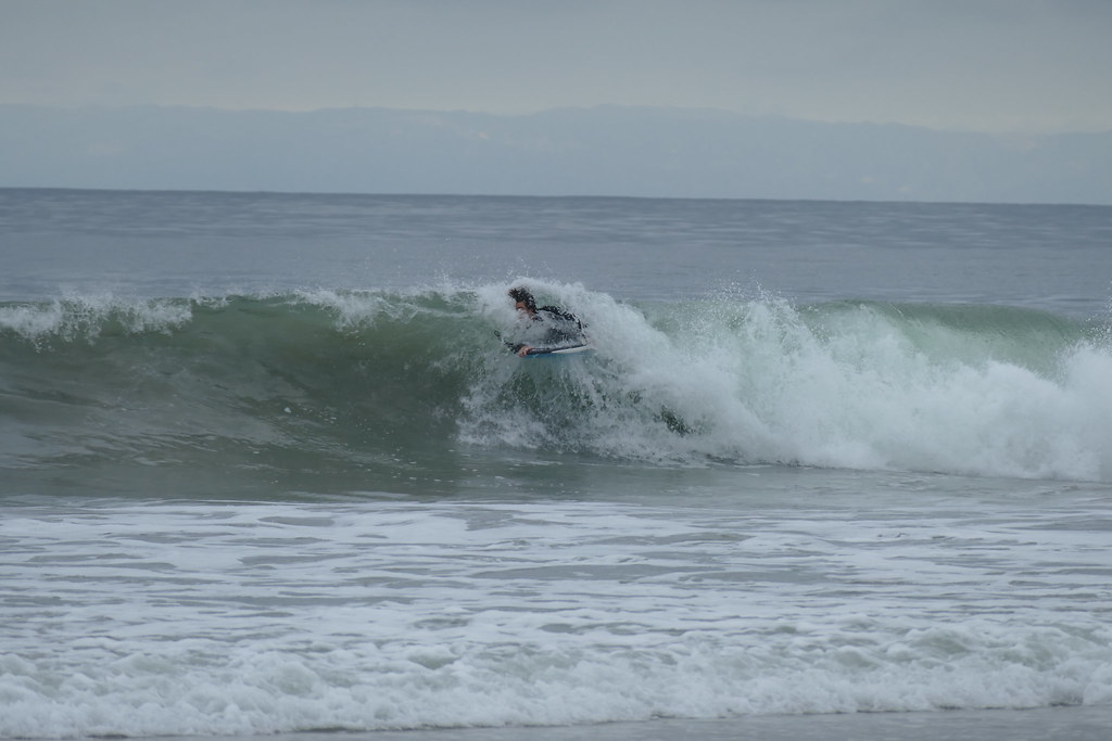 CdM surfer hitting the whitewater on a gray-day session